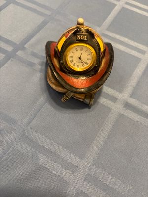 Red hats of courage fire helmet clock Clock doesnt work