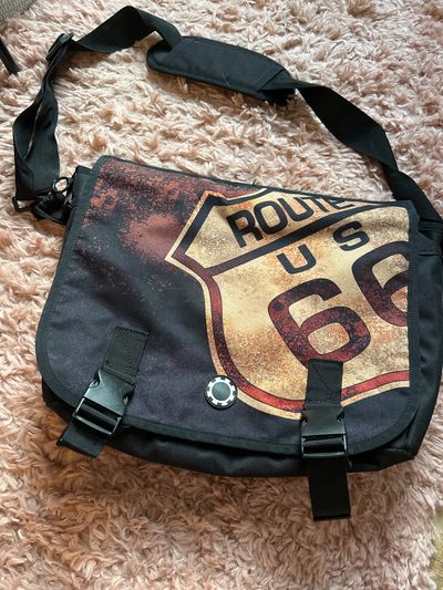 Route 66 messenger style diaper bag So many pockets and areas to attach things. Such a great bag!