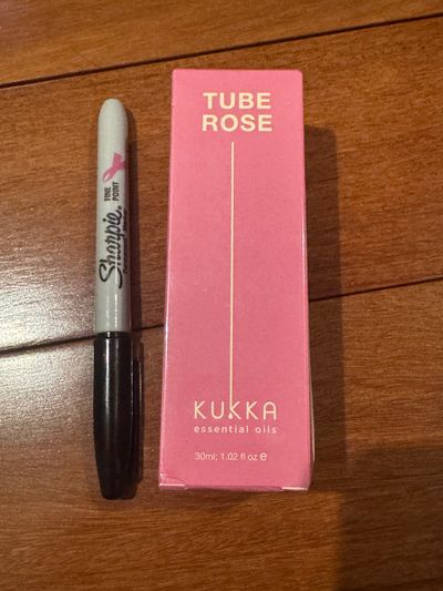 Brand new tube rose essential oil
