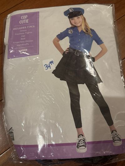 Brand new cop cutie, seven piece costume Size large fits 12 to 14