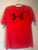 Under Armor size XL S/S red athletic shirt w/ black symbol 14-16