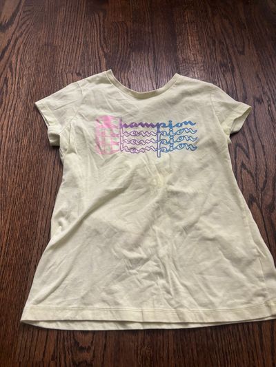 Yellow champion, short sleeve T-shirt Size large 10-12