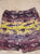 Flopdoodles purple and yellow swim trunks feature a detailed shark print 7-8