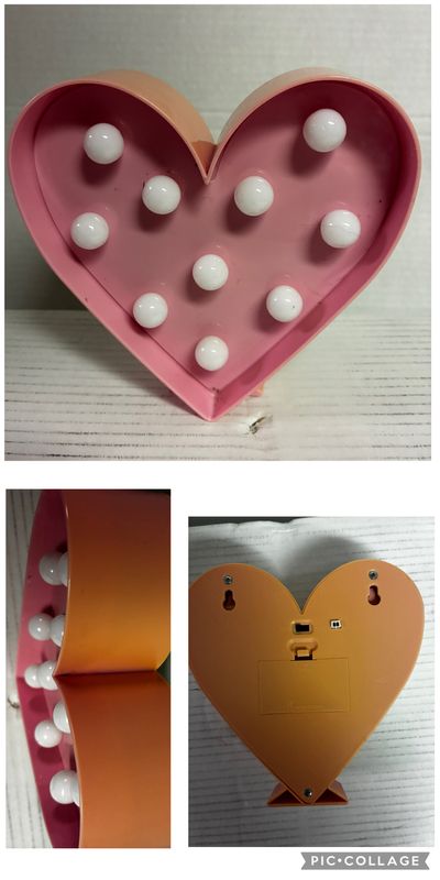 6.5 inch pink heart on stand. Can light up Some sun fading on top