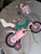 Rainbow 1.0 Pink and teal bike with basket and baby doll seat - missing 1 str 12 Kids Bike