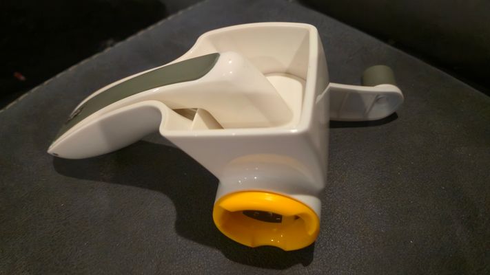 Hand crank rotating cheese grater