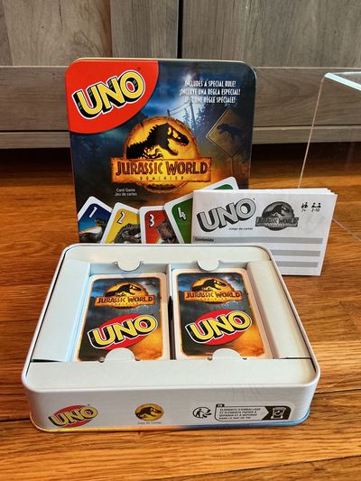 Mattel Jurassic World Uno set in tin container