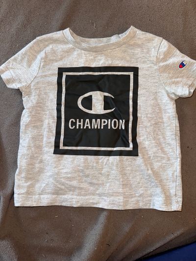 Champion Grey short sleeve shirt. Brand tag has been worn out 2T