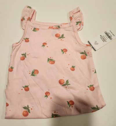 Carters peach onesie tank top New with tag. Bottom is folded up in photo 24 Months