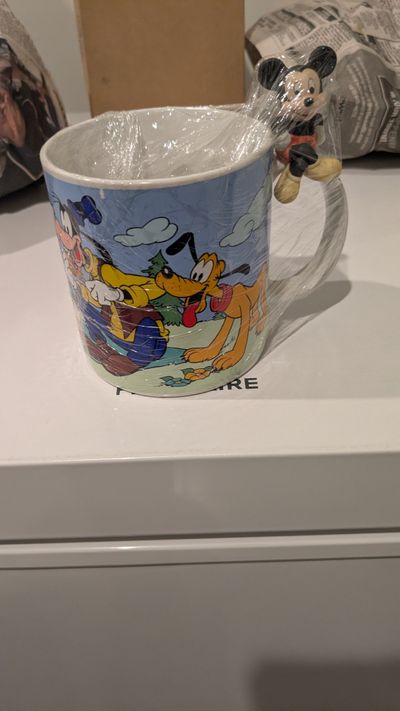 Disney Mug depicts Mickey and friends having a picnic