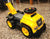 Mega Bloks CAT 3-in-1 ride-on toy. The steering wheel has controls that produce realistic truck soun