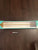 Brand new pillowfort wall shelf, 24 inches long By 4 1/2 wide color is white with a gold metal rail hold 12 lbs
