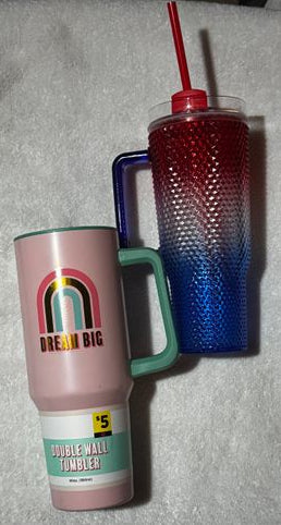 2 Stanley style cups. One is missing a straw 2 Stanley style cups. One is missing a straw