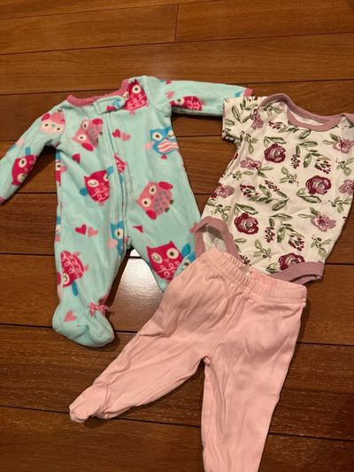 3 pieces of newborn size clothing  Newborn