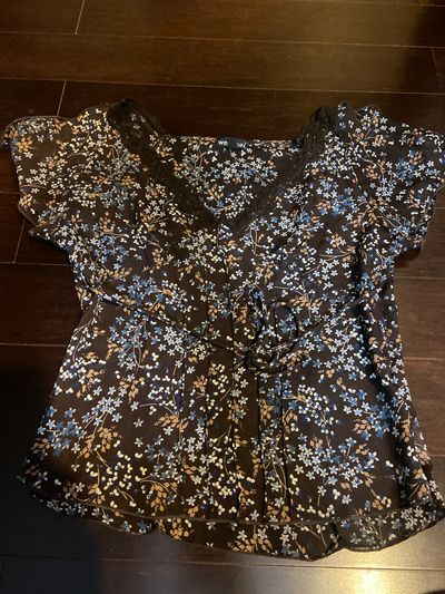 Wet Seal Brown short sleeve shirt with blue and tan flower design. Women's - S