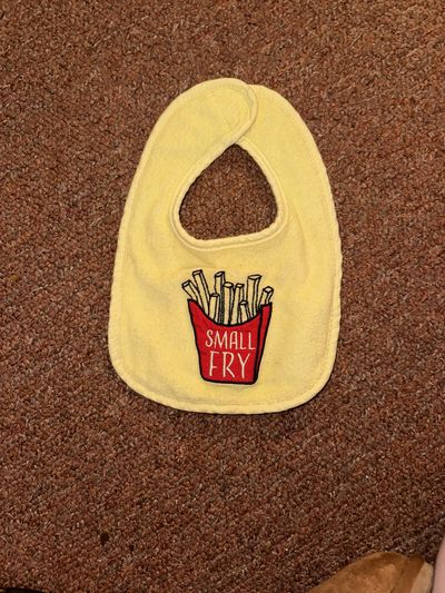 Hudson Baby yellow bib with fry slogan