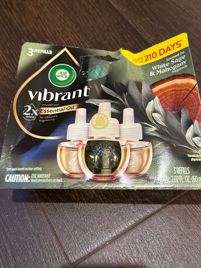 Brand new Airwick vibrant three pack of air freshe Refills scented oil, white, sage, and mahogany box has wear