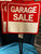 NEW 2 plastic garage sale signs with yard stake Laminated sign 15wide.x 14 high 26 inch high  w stake