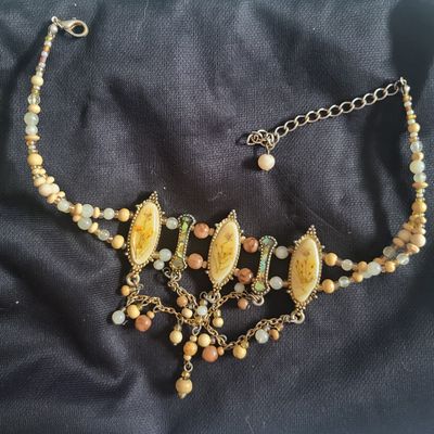 unknown necklace w/3 ovals w/yellow pressed flowers and dangling beads