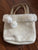 White hand bag