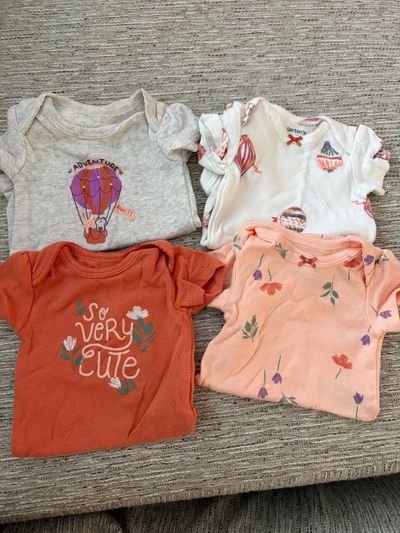 Carters Like new four onesies Newborn