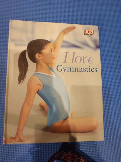 hardcover children's book I Love Gymnastics publis hardcover children's book I Love Gymnastics published by DK.