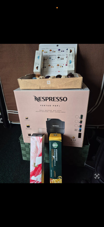 NEW Nespresso Vertuo machine with a variety of cap