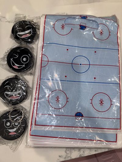 New 50 plus Hockey Goody Bags with puck keychains Over 50 goody bags and also includes 4 foam hockey puck keychains