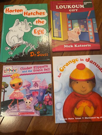 4 books, 3 hardcover Dr. Seuss, and loukoumi An orange in January, Lalaloopsy book all in great condition