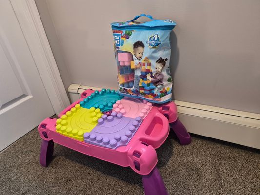 Mega Blocks table and assorted blocks Used condition. Over 100 blocks included
