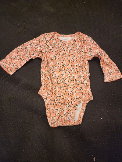 Carter long-sleeve bodysuit features a vibrant orange and black floral p 3 Months