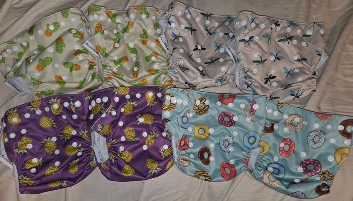 Set of 8 cloth diaper COVERS. NO CLOTH INSERTS These do have the insert pockets if you need otherwise just cover