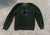 H & M Sparkly dinosaur on a green sweater. Tag says US 6 to 8Y 7-8