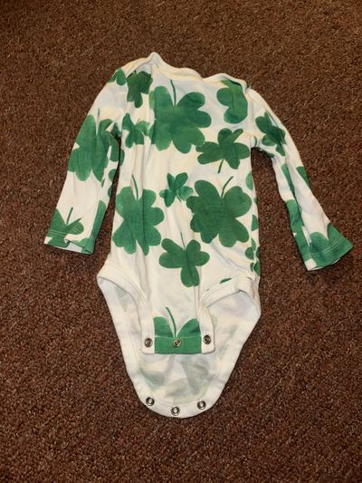 Carter's white with green shamrocks long sleeve onesie 9 Months