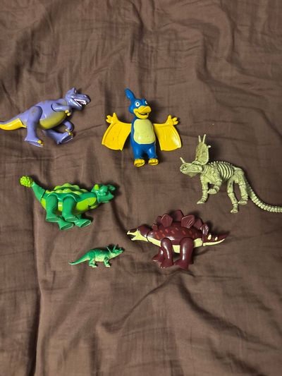 None #8 Dinosaur figurines 2in-4in long