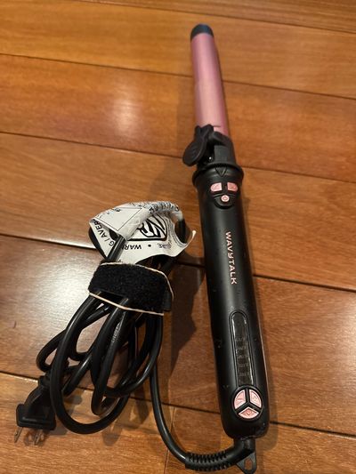 Wavy talk curling iron different attachments can Be purchased this one is about 1 inches barrel