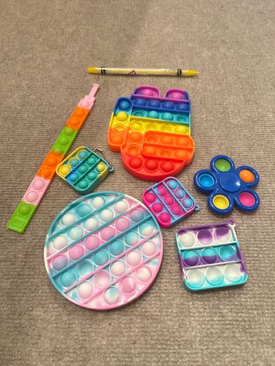 NA Lot of fidget toys. Pencil for size reference