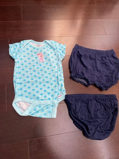 Gerber and carters Onesie is Gerber 0-3. Bottoms are 3 months carters 0-3 Months